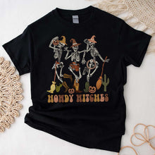 Load image into Gallery viewer, Howdy Witches Halloween T-shirt, Retro Halloween, Skeletons Dancing Cowgirl Shirt, Skeleton Cowboy
